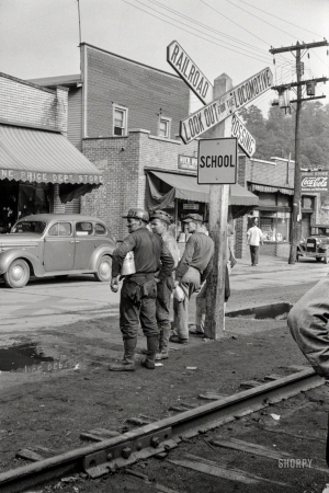 Photo showing: Look Out -- September 1938. Coal miners waiting for the bus to go home in Osage, West Virginia.
