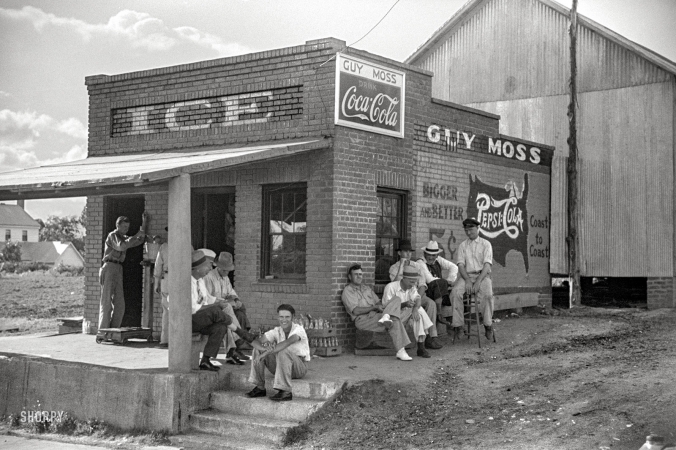 Photo showing: Ice House Gang -- June 1939. Greene County, Georgia. Men hanging around crossroads store.