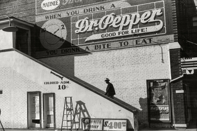 Photo showing: Delta Matinee -- Oct. 1939. Belzoni, Miss., in the Delta area. Negro man entering movie theater by 'Colored' entrance.