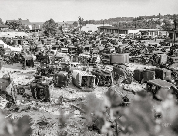 Photo showing: Junkscape -- August 1941. Conservation. Scrap iron and steel. An automobile graveyard outside Baltimore.