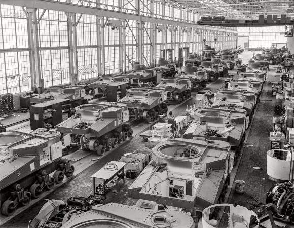 Photo showing: Arsenal of Democracy -- August 1941. Warren, Michigan. Partially completed M-3 tanks, 28-ton
steel giants being turned out at the huge Chrysler tank arsenal near Detroit.