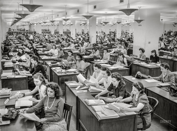 Photo showing: The Deep State -- October 1942. Washington. D.C. Clerical workers processing forms
for production requirement plan -- Priorities Division, War Production Board.