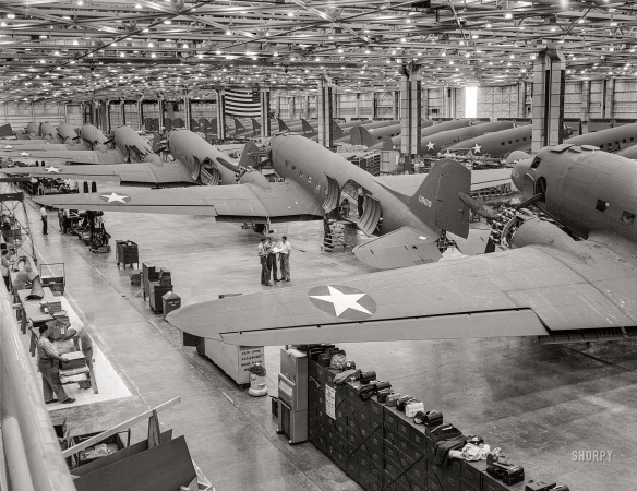Photo showing: Mobilized -- -- October 1942.  Long Beach, California. C-47 transport planes on the assembly lines at the Douglas Aircraft plant.