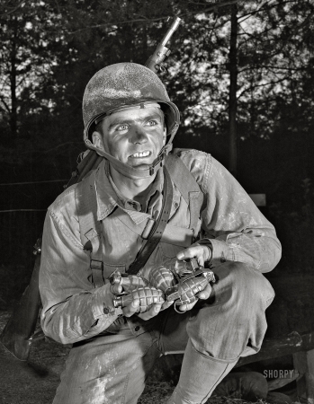 Photo showing: The Jolly Grenadier -- November 1942. Ready to make a shipment of pineapples
to Hitler, Hirohito & Co. An infantryman at Fort Belvoir, Virginia ... 