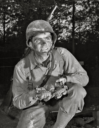 Photo showing: The Jolly Grenadier -- November 1942. Ready to make a shipment of pineapples
to Hitler, Hirohito & Co. An infantryman at Fort Belvoir, Virginia ... 
