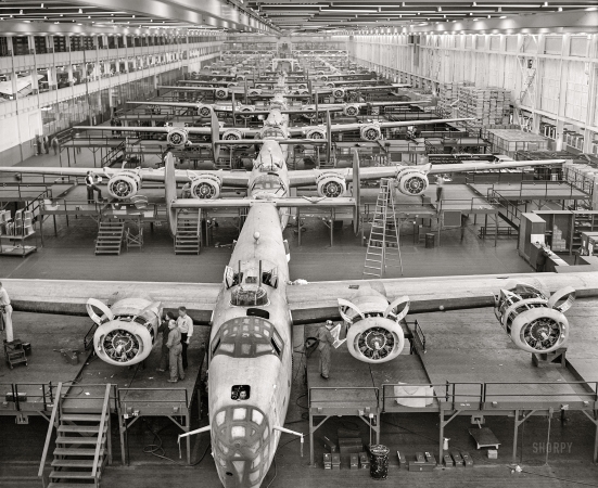 Photo showing: Avenging Angels -- February 1943. Looking up an assembly line at Ford's big Willow Run plant
in Michigan, where B-24E (Liberator) bombers are being made in great numbers.