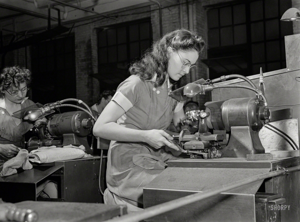 Photo showing: Knows the Drill -- August 1942. War worker at Republic Drill and Tool, Chicago.