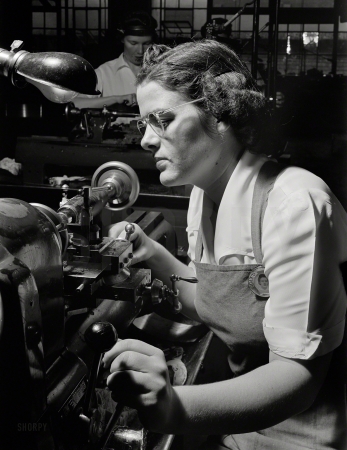Photo showing: Agnes the Operator -- July 1942. Agnes Mahan, bench lathe operator at a large Eastern firearms plant.
