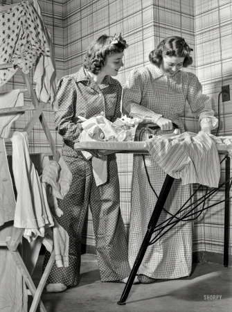 Photo showing: Iron Maidens -- October 1942. Down goes the thermometer and out come flannel nightclothes, as government workers in
Washington, D.C., dress for the 65-degree maximum temperature recommended by the fuel oil limitation order.