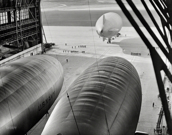Photo showing: Naval Gazers -- January 1943. U.S. Navy blimp about to take off on patrol flight over the Atlantic.