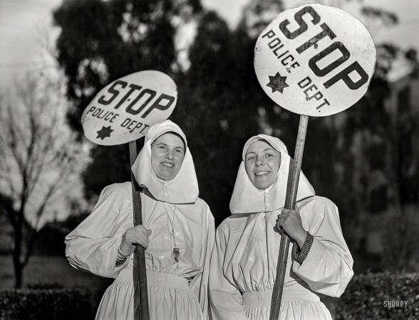Photo showing: Traffic-Stoppers -- February 1943. Mrs. E.K. Sabel and Mrs. J.R. Harris, members of the Women's Safety Traffic Reserve in Oakland, California.