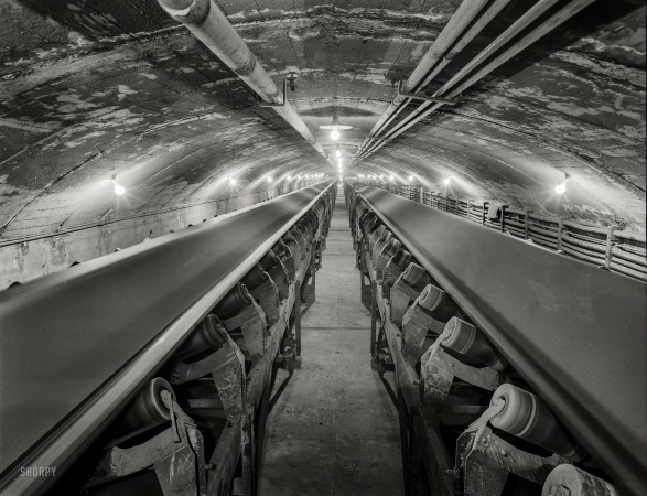 Photo showing: Cu Later -- 1942. Conveyor belts carrying copper ore through a tunnel at the Magna mill of the Utah Copper Co.