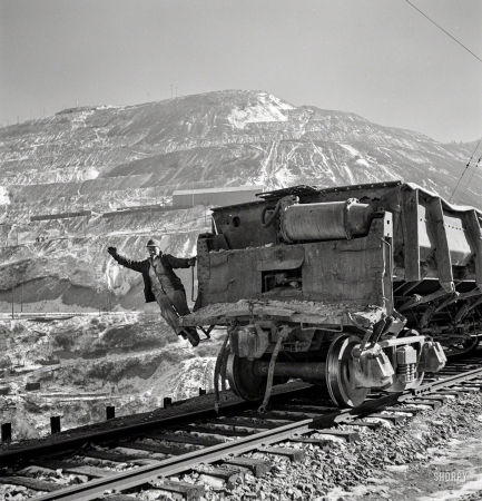Photo showing: Utah Copper -- November 1942. Brakeman of an ore train at the open-pit mining operations of Utah Copper Co. at Bingham Canyon, Utah.