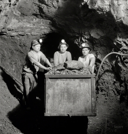 Photo showing: Quicksilver Car -- December 1942. Loading mercury ore into a mine car at the New Idria,
California, plant of the New Idria Quicksilver Mining Company.