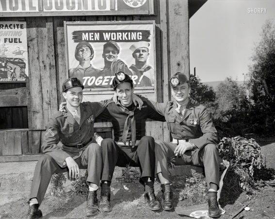 Photo showing: Men Smoking Together -- October 1942. War production drive. Anthracite rallies. Servicemen working together!