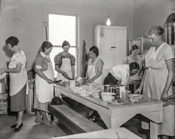Photo showing: Naked-Bulb Lunch -- April 1935. Women volunteers preparing school lunch. Reedsville, West Virginia.