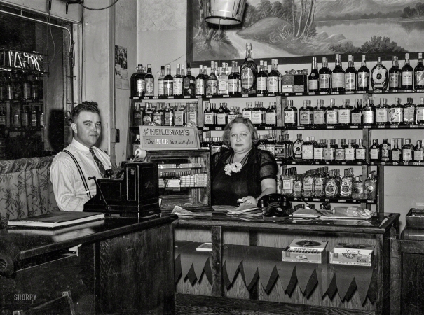Photo showing: 99 Bottles ... -- October 1938. North Platte, Nebraska. Manager of the Alamo bar, and Mildred Irwin, entertainer.