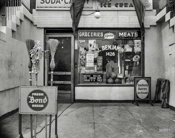 Photo showing: Bread, Brooms and Beyond -- August 1942. Washington, D.C. Grocery store at 1426 11th Street N.W.