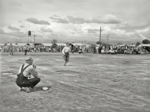 Photo showing: Farm Team -- March 1940. Baseball game at Tulare migrant camp. Visalia, California.