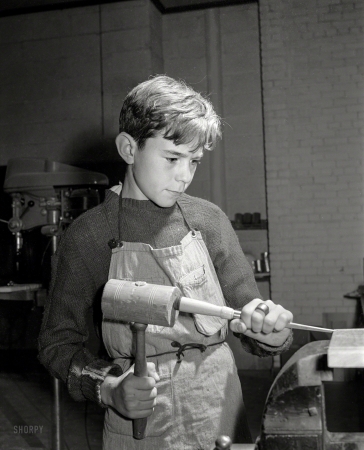 Photo showing: Grooving Wood -- December 1941. Boy grooving wood in shop class at homestead school. Dailey, West Virginia.