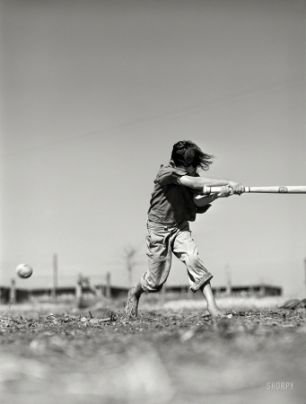 Photo showing: Robstown Slugger -- January 1942. Saturday morning baseball game. Farm Security Administration camp in Robstown, Texas.