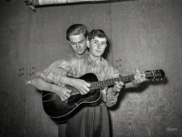 Photo showing: Weldon and Sleepy -- February 1942. Weldon and Jasper Sleepy Drake, performing at a barn dance in Weslaco, Texas.
