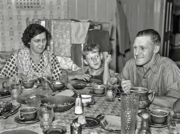 Photo showing: Dads Say the Darndest Things! -- September 1937. McNally family dairy farm in Kirby, Vermont. The McNallys at dinner.