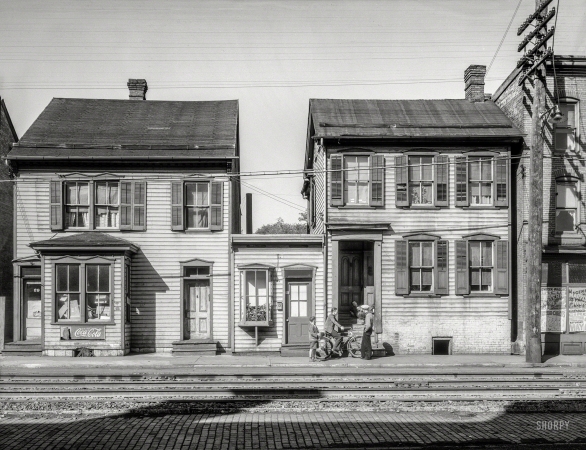 Photo showing: Making the Rounds -- October 1937. Houses near the railroad tracks. Hagerstown, Maryland.
