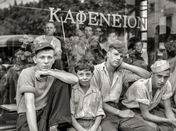 Photo showing: Kafeneion -- July 1938. Boys in the town in front of Greek coffee shop. Ambridge, Pennsyl­vania.