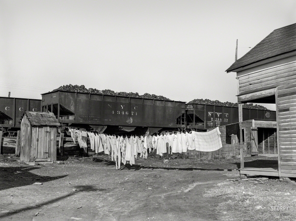 Photo showing: Left Hanging -- January 1939. Clean clothes. Carrier Mills, Saline County, Illinois.