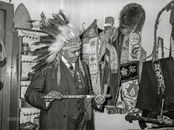 Photo showing: Medicine Man -- January 1939. Dr. Springs with Indian relics. Colp, Illinois.