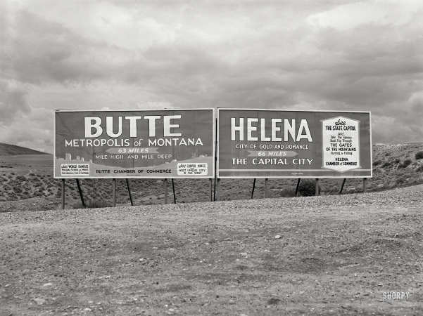 Photo showing: Choices -- June 1939. Signs at highway intersection. Three Forks, Montana.