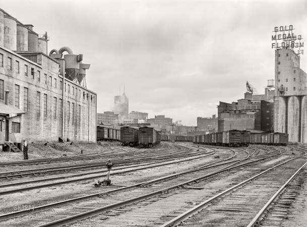 Photo showing: Mill-Industrial -- September 1939. Railroad yards and flour mills. Minneapolis, Minnesota.