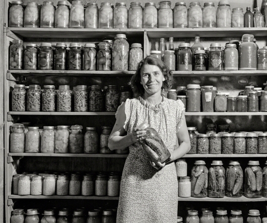 Photo showing: Wife Preserver -- October 1939. Mrs. H.H. Poland, wife of FSA rehabilitation client, with preserved food. Mesa County, Colorado.