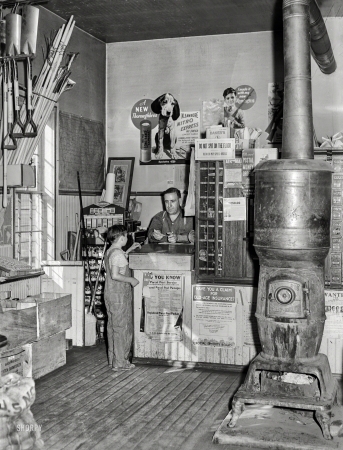 Photo showing: Nitro Express -- October 1939. Post office in the general store. Lamoille, Iowa.