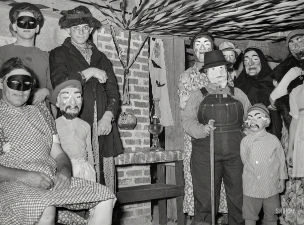 Photo showing: Bal Masque -- October 1939. Masquerade at Halloween party. Hillview cooperative, Osage Farms, Missouri.