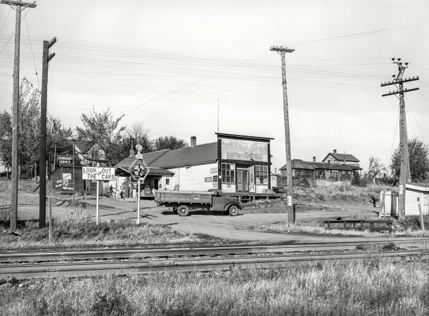 Photo showing: Standard Service -- October 1939. Lamoille, Iowa. A village consisting of a few houses, general store, and railroad station.