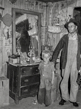 Photo showing: And a Little Child -- November 1939. Former tiff miner, now blind, with son. Washington County, Missouri.