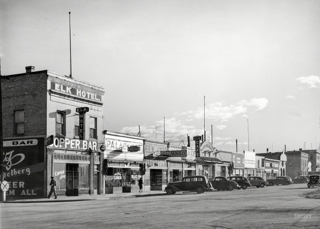 Photo showing: Elko Tango -- March 1940. Stores on main street. Elko, Nevada.