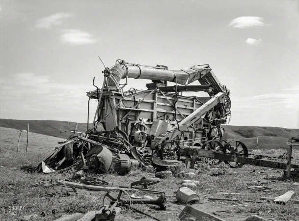 Photo showing: Badlands -- September 1937. Old threshing machine on Herman Gerling's farm
near Wheelock, North Dakota. There have been no crops for eight years.