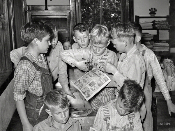 Photo showing: Comic Con -- April 1939. San Augustine, Texas. Grade-school boys making books of comic strips.