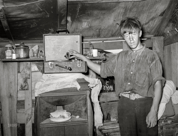 Photo showing: Record Time. -- July 1939. Boy living in camp near May Avenue, Oklahoma City.