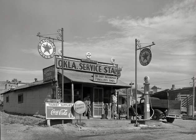 Photo showing: Little Oklahoma -- September 1939. Service station run by former resident of Oklahoma in Questa, New Mexico.