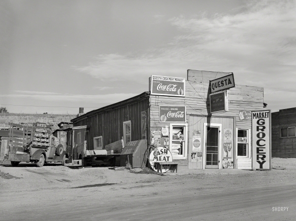 Photo showing: Free Air, Cash Meat -- September 1939. Market and grocery in Questa, New Mexico.