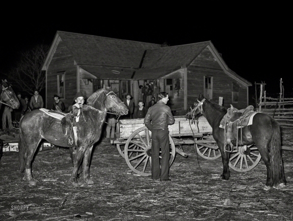 Photo showing: Play Party -- February 1940. Farm boys tying up their horses at a 'play party' in McIntosh County, Oklahoma.