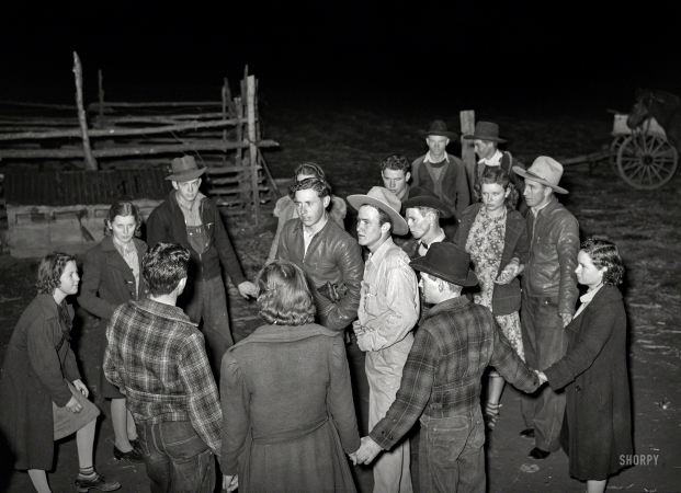 Photo showing: The Night Is Young -- February 1940. Boys and girls deciding what game to play next at 'play party' in McIntosh County, Oklahoma.