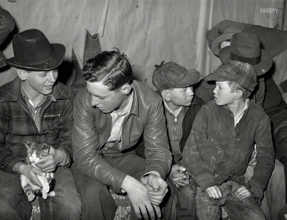 Photo showing: Twenty Questions -- February 1940. Farm boys at 'play party' in McIntosh County, Oklahoma.