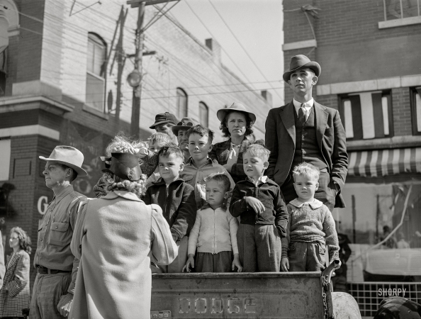 Photo showing: A Bumper Crop - -- March 1940. San Angelo, Texas. Watching the parade which opened the Fat Stock Show.