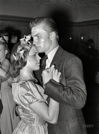 Photo showing: Getting Serious -- March 1940. Young couple at the Junior Chamber of Commerce dance during the San Angelo Fat Stock Show.
