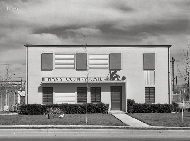 Photo showing: Jailbirds -- March 1940. Hays County Jail, San Marcos, Texas. Living quarters for the Deputy Sheriff are downstairs.